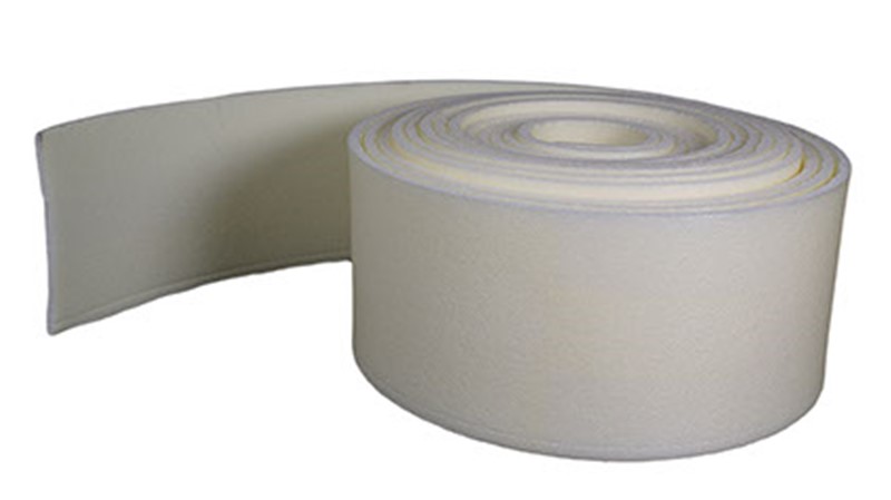 Polyethylene foam expansion joint filler, undercut and perforated to form a near mastic joint.