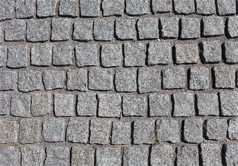 Grey granite setts in natural split finish. Transform your landscaping with our Grey Granite Setts, naturally split for a distinctive look. Perfect for enhancing driveways, paths, and patios, these setts combine aesthetic appeal with durability. Our quality grey granite setts are packed in wooden crates, ensuring secure and easy transportation.